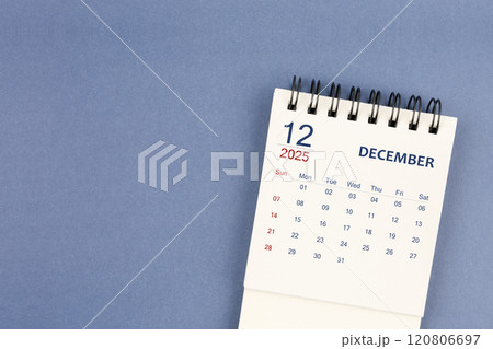 December 2025 Mini monthly desk calendar for 2025 year on blue color background. 120806697