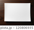 A blank white sheet of paper lies on a table. High quality photo 120806935