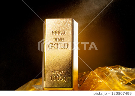 Melting Gold Bar Flowing into Liquid spray wealth prosperity. Gold bar standard is bank reserve to finance economic, golden liquid water splash as price up down. Black background isolated 120807499