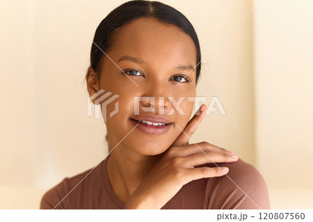 Young Woman With Radiant Skin Practicing Natural Beauty and Face Care Young Woman With Radiant Skin Practicing Natural Beauty and Face Care 120807560