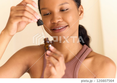 Skin Routine. Woman Applying Facial Serum for Healthy and Skin Skin Routine. Woman Applying Facial Serum for Healthy and Skin 120807564