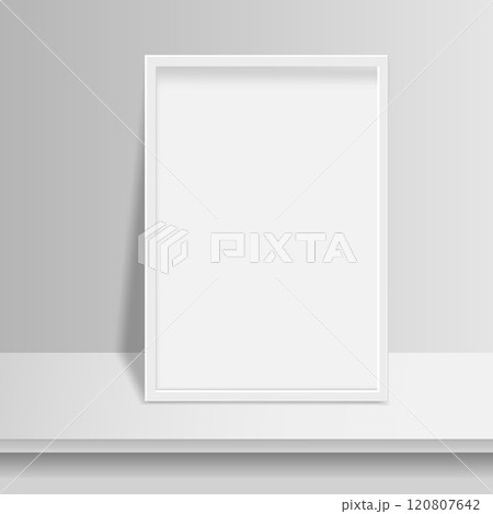 Empty white picture frame mockup on table Empty white picture frame mockup on table 120807642