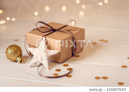 Christmas gift box and decorations on white wooden table. Christmas gift box and decorations on white wooden table. 120807650