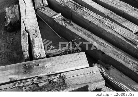 Close-up of weathered wooden beams in black and white composition 120808358