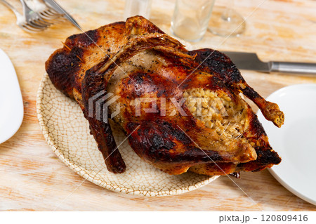 Browned baked duck stuffed with barley and mushrooms 120809416
