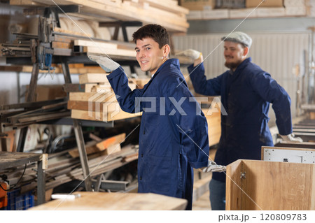 Two funny sawmill workers perform various funny moves Two funny sawmill workers perform various funny moves 120809783