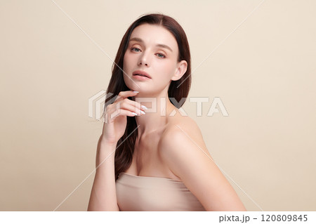 Beautiful young woman with clean fresh skin on beige background, Face care, Facial treatment, Cosmetology, beauty and spa, women portrait. 120809845