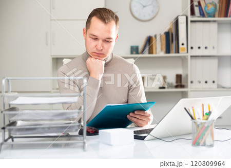 Portrait of thoughtful man office worker Portrait of thoughtful man office worker 120809964