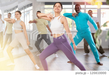 Young Asian woman practicing active dance in training hall Young Asian woman practicing active dance in training hall 120810000