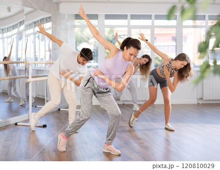 Group of men and woman dancing hip hop Group of men and woman dancing hip hop 120810029