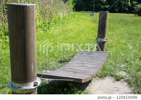 Relaxation Spot in Nature with Wooden Hammock Relaxation Spot in Nature with Wooden Hammock 120810896