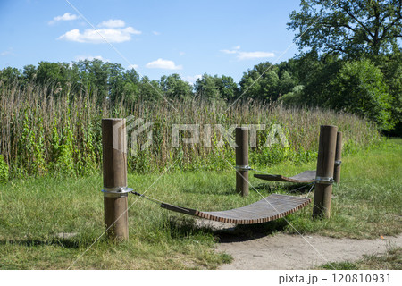 Relaxation Spot in Nature with Wooden Hammock Relaxation Spot in Nature with Wooden Hammock 120810931