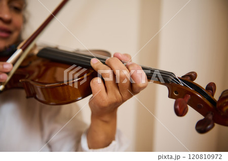 Close-up of musician playing a violin with skill and passion 120810972