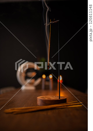 Burning aromatic incense smoky stick for meditation and relaxing. Aromatherapy smoke for yoga concept. 120811148