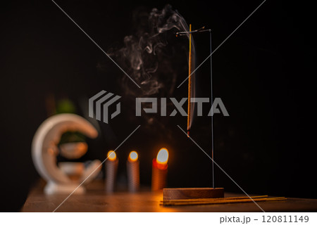 Burning aromatic incense smoky stick for meditation and relaxing. Aromatherapy smoke for yoga concept. 120811149