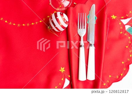 An Elegant and Beautiful Christmas Table Setting Complete with Ornamental Decorations and Fine Cutlery for Dinner An Elegant and Beautiful Christmas Table Setting Complete with Ornamental Decorations and Fine Cutlery for Dinner 120812817