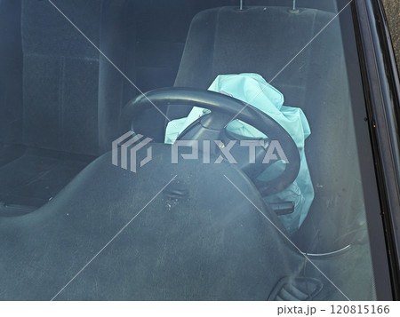 Opened airbag in automobile. Car safety equipment Opened airbag in automobile. Car safety equipment 120815166