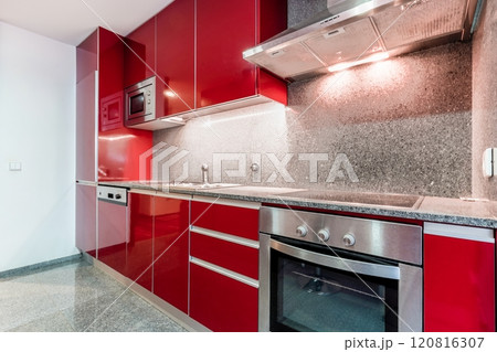 Red colour glossy kitchen interior 120816307