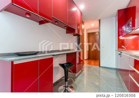 Red colour glossy kitchen interior 120816308