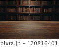 Central view of wooden table with antique bookshelves in a dark brown, shallow depth of field backdrop 120816401