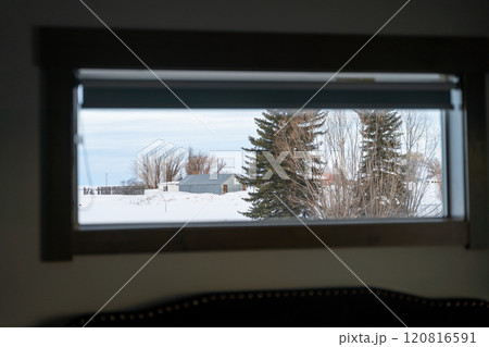 Framed Winter Scene Through a Window in Idaho's Snow-Covered Countryside. 120816591