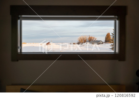 Framed Winter Scene Through a Window in Idaho's Snow-Covered Countryside. 120816592