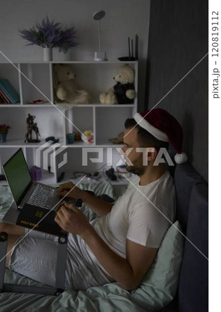 30-year-old man with a Bible attends an online church service, talks with the pastor 120819112