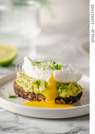 Avocado toast with poached egg Avocado toast with poached egg 120821488