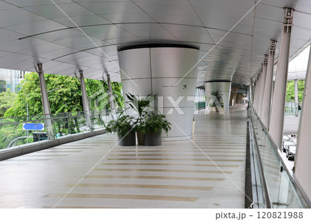 Pedestrian pathway or corridor or hallway between train station and other building. 120821988