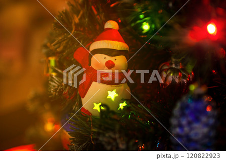 Beautiful festive decorations on the Christmas tree. New Year 2025 Beautiful festive decorations on the Christmas tree. New Year 2025 120822923