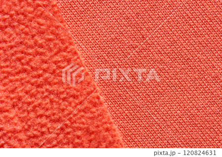 Close up of contrasting textures in bright orange fabric textiles Close up of contrasting textures in bright orange fabric textiles 120824631
