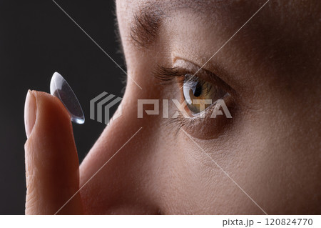 girl wearing soft contact lenses close-up macro, Beauty, vision, ophthalmology girl wearing soft contact lenses close-up macro, Beauty, vision, ophthalmology 120824770