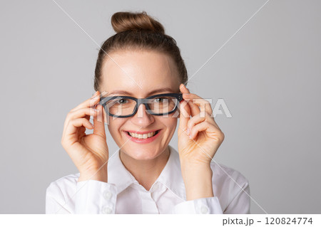 Portrait of smiling woman wearing glasses isolated on white studio background. Eyesight test and vision loss, vision treatment concept 120824774