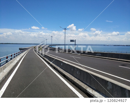 Riding along the part of the toll road designated for motorcycles across the water Riding along the part of the toll road designated for motorcycles across the water 120824927