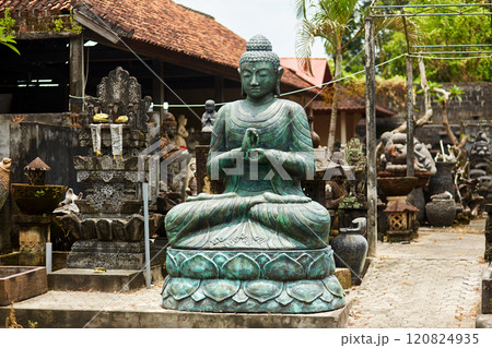 Sculpture of a temple with flowers and incense for ritual offerings on the popular tourist island of Bali. Sculpture of a temple with flowers and incense for ritual offerings on the popular tourist island of Bali. 120824935