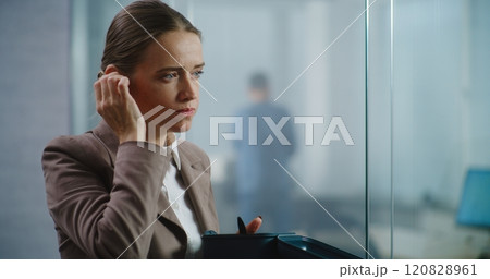 Marketing specialist eats food, discusses business strategy using wireless headphones 120828961