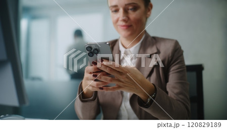 Caucasian businesswoman chats with business partner using mobile phone Caucasian businesswoman chats with business partner using mobile phone 120829189