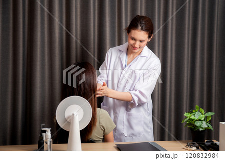 Young asian patient woman consulting with doctor in coat about wrinkle and skin for rejuvenate. 120832984