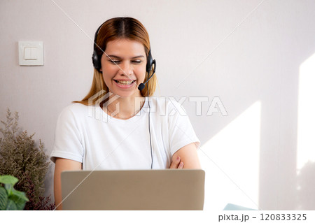 Professional young business woman working and meeting online in modern home office. Professional young business woman working and meeting online in modern home office. 120833325