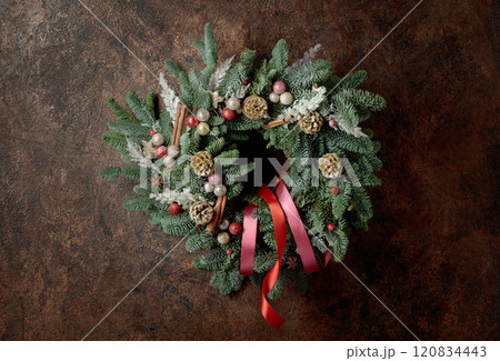 Christmas wreath on a brown vintage background. Christmas wreath on a brown vintage background. 120834443