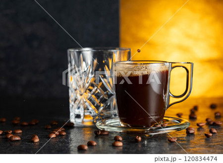Espresso, glass of cold water, and roasted coffee beans. Espresso, glass of cold water, and roasted coffee beans. 120834474
