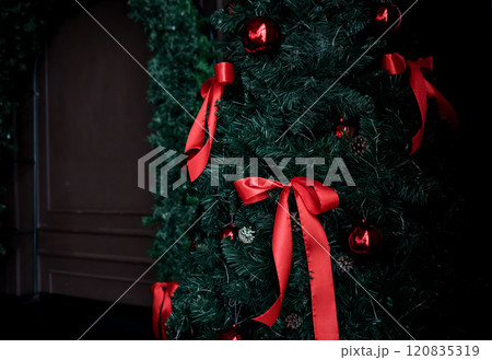 Christmas tree with red bows 120835319