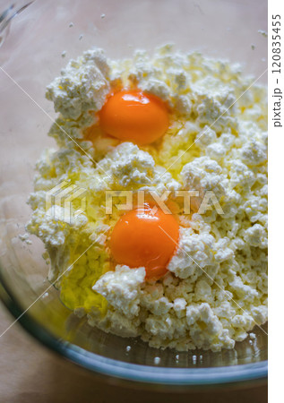 Fresh eggs and cottage cheese close-up for cooking or baking ingredients. High quality photo 120835455