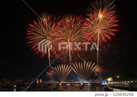 People enjoyed Fireworks show on Memorial bridge cross the Chao Phraya river People enjoyed Fireworks show on Memorial bridge cross the Chao Phraya river 120836208