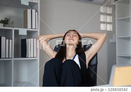 Stressed Business Woman at Work in Modern Office Environment Experiencing Overwhelm and Fatigue Stressed Business Woman at Work in Modern Office Environment Experiencing Overwhelm and Fatigue 120838582