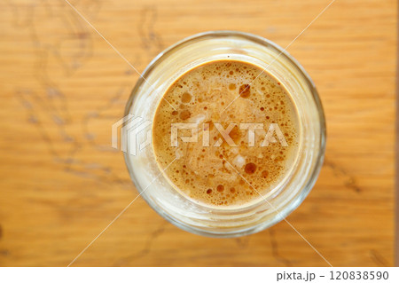 Cup of Dirty coffee on rustic wooden background. Selective focus. Top view. Cup of Dirty coffee on rustic wooden background. Selective focus. Top view. 120838590