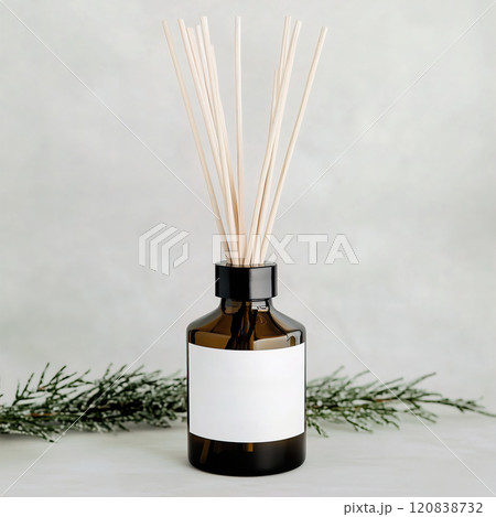 A beautifully crafted bottle of reed diffuser accompanied by sticks. Diffuser white blank label mockup A beautifully crafted bottle of reed diffuser accompanied by sticks. Diffuser white blank label mockup 120838732