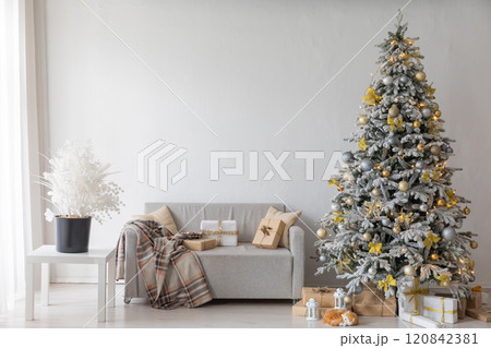 White Christmas tree with gifts garlands in the interior for the new year 120842381