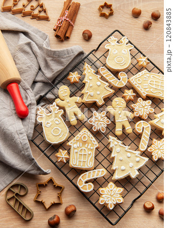 Christmas cookies cooling on rack with festive shapes and decorations, Christmas cookies cooling on rack with festive shapes and decorations, 120843885