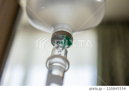Close up medical intravenous IV drip in hospital background 120845554